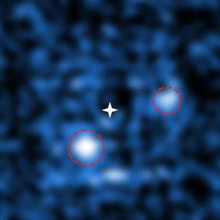 To capture this image, researchers at the Very Large Telescope carefully filtered the light from the central star. PDS 70b is visible at the lower left and PDS 70 c is visible at the upper right.