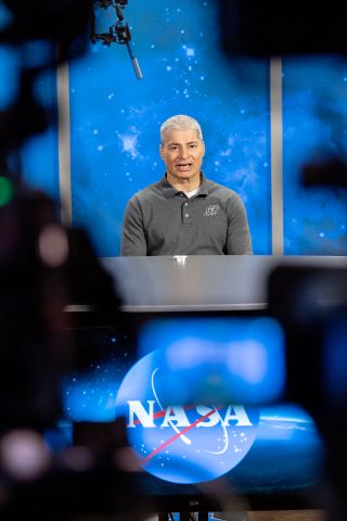 Framed by television cameras, NASA astronaut Mark Vande Hei takes part in his first press conference since returning from a record 355 days in space at NASA's Johnson Space Center in Houston, Texas, on Tuesday, April 5, 2022.