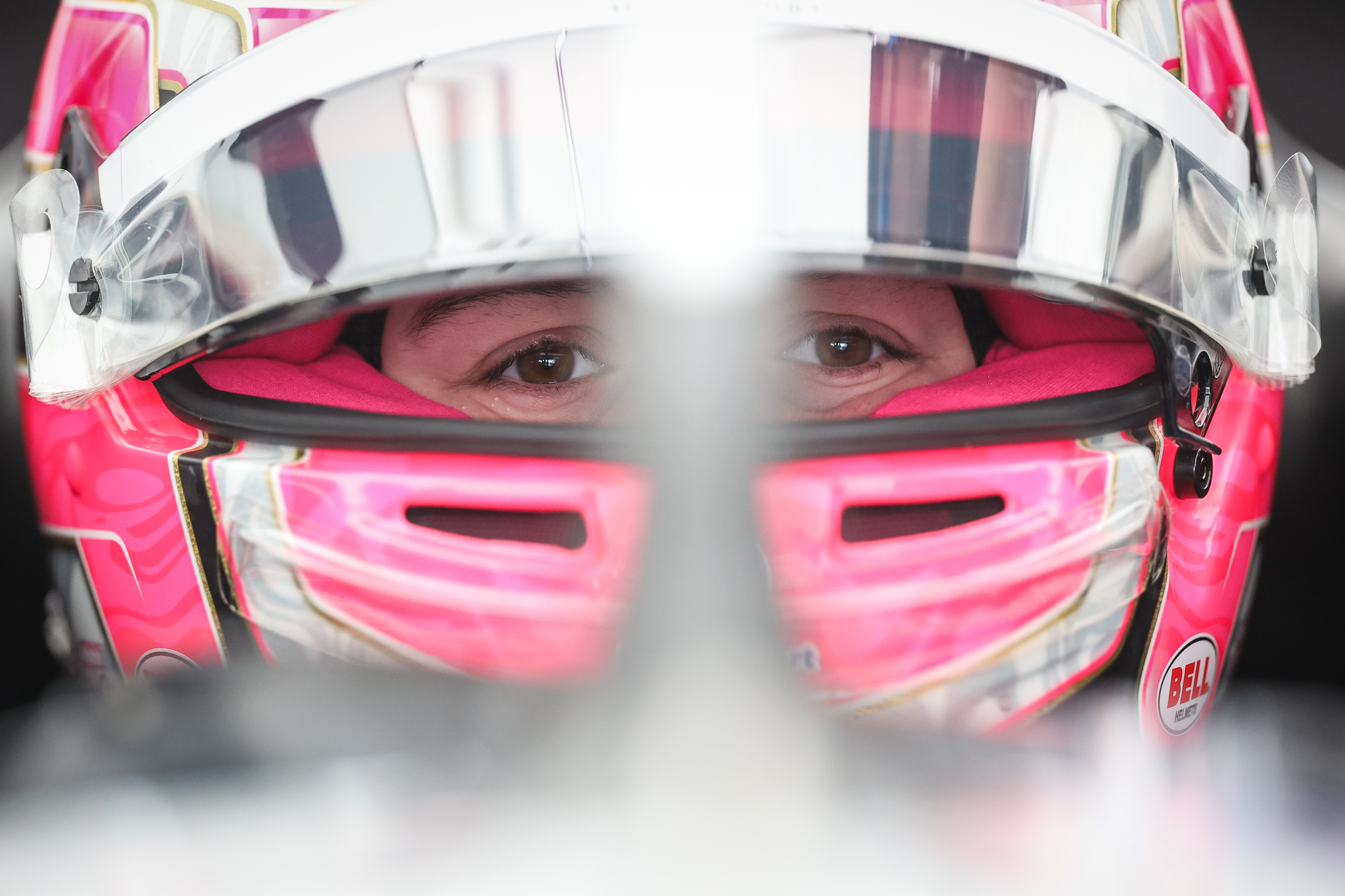 Close-up shot of a girl wearing a racing helmet