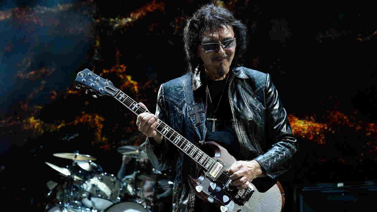 Tony Iommi performing onstage in 2016