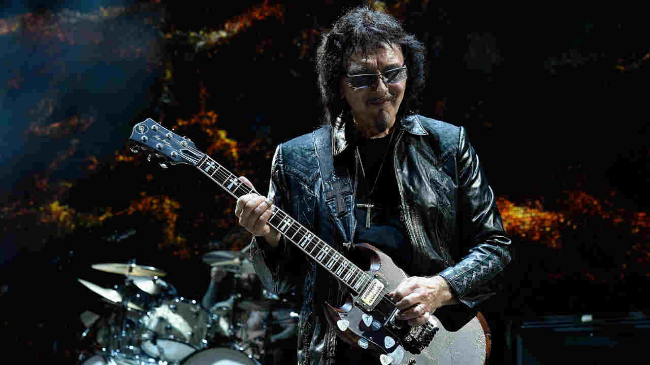Tony Iommi performing onstage in 2016