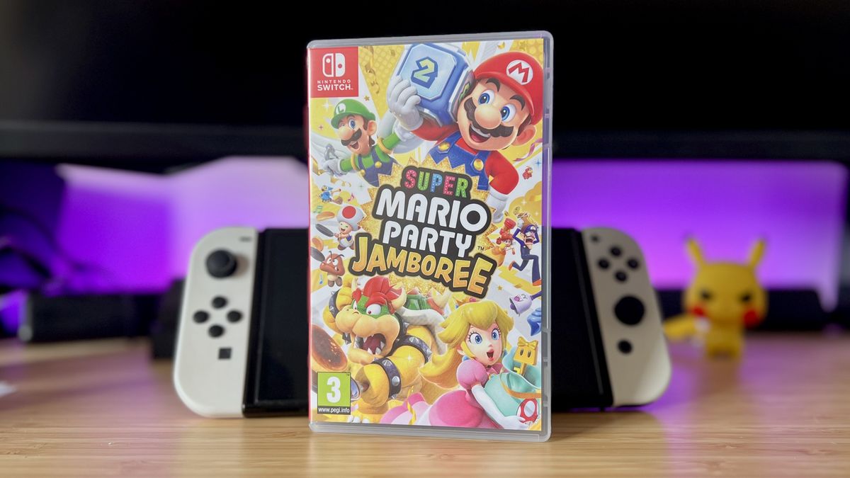 Super Mario Party Jamboree game leaning against Switch OLED with purple lighting