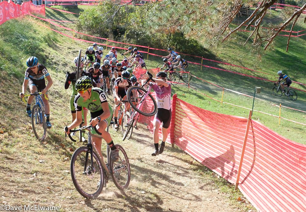 Gage Hecht (Alpha Bicycle) leading the race while others get caught up in the course barrier
