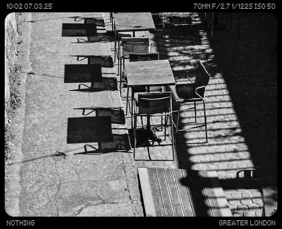 A courtyard full of tables and chairs