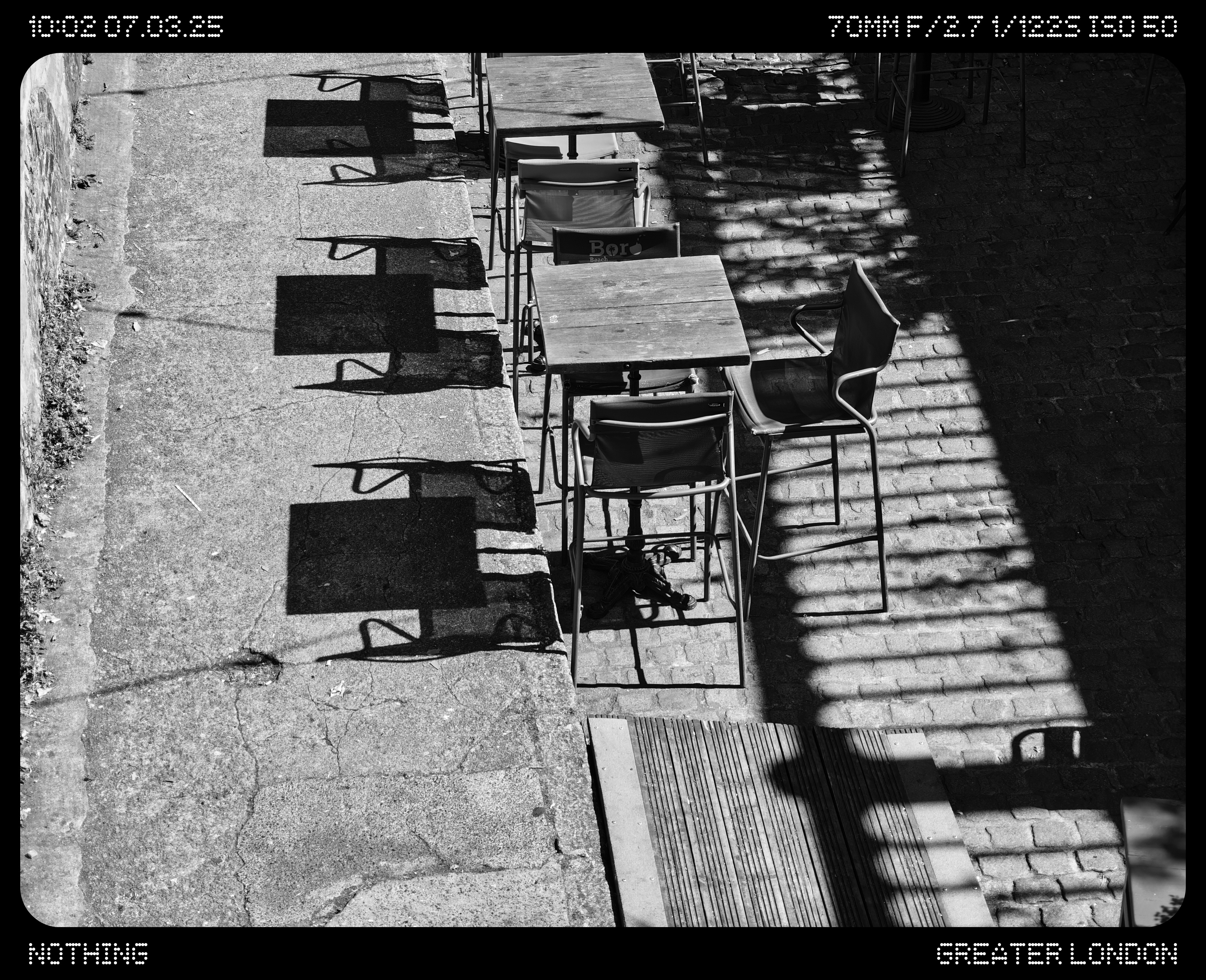 A courtyard full of tables and chairs