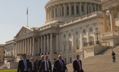Lobbyists walk past the U.S. Capital last year: Nearly 700 congressional staffers owe a combined $10.6 million in unpaid 2010 taxes.