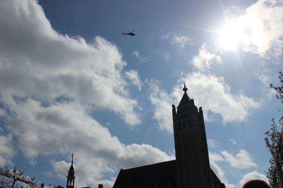 The helicopter soaring above a sunny Flanders, ready to film the action