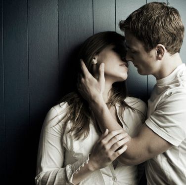 married couple kissing