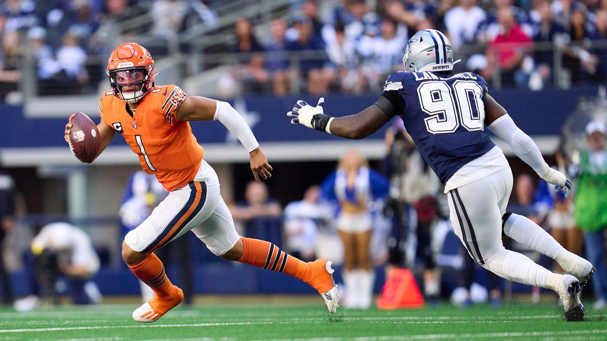 Justin Fields #1 of the Chicago Bears scrambles against the Dallas Cowboys during the first half at AT&amp;T Stadium on October 30, 2022 in Arlington, Texas.