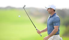 Rory McIlroy catches a golf ball