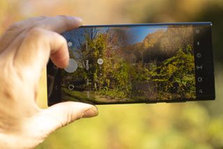 Samsung Galaxy S22 Ultra against foliage
