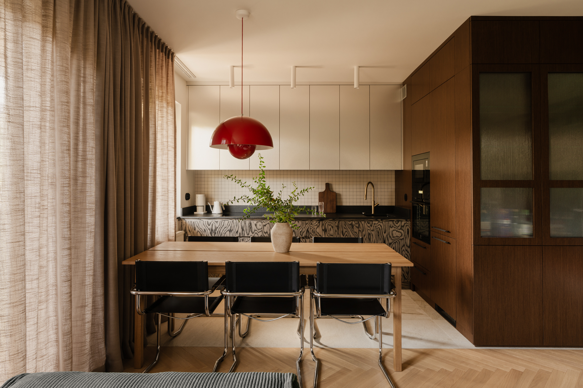 minimal mid-century modern kitchen with wooden walls and patterned veneer cabinets