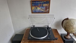 Audio-Technica AT-LP70XBT turntable on a wooden table