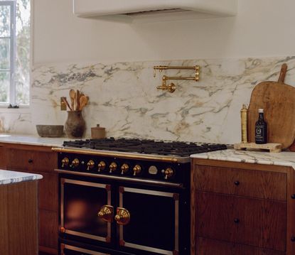 A kitchen with natural stone and materials