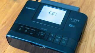 Canon SELPHY CP1300 Wireless Compact Photo Printer being tested in writer's home