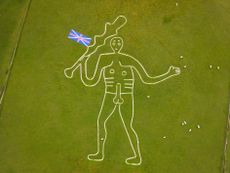 CERNE ABBAS, ENGLAND - JUNE 05: The Cerne Abbas Giant hill figure is seen with the addition of a Union Jack flag on his club in celebration of the Platinum Jubilee, on June 05, 2022 in Cerne Abbas, England. The Platinum Jubilee of Elizabeth II is being celebrated from June 2 to June 5, 2022, in the UK and Commonwealth to mark the 70th anniversary of the accession of Queen Elizabeth II on 6 February 1952. (Photo by Finnbarr Webster/Getty Images)