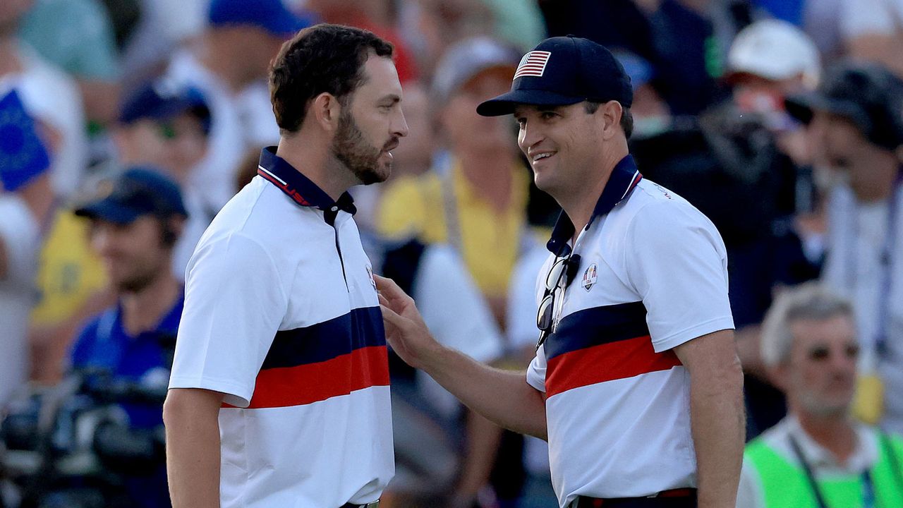 Zach Johnson speaks to Patrick Cantlay on the 18th green