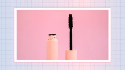 Black mascara with a brush in a pink bottle on a pink background/ in a blue and pink check template