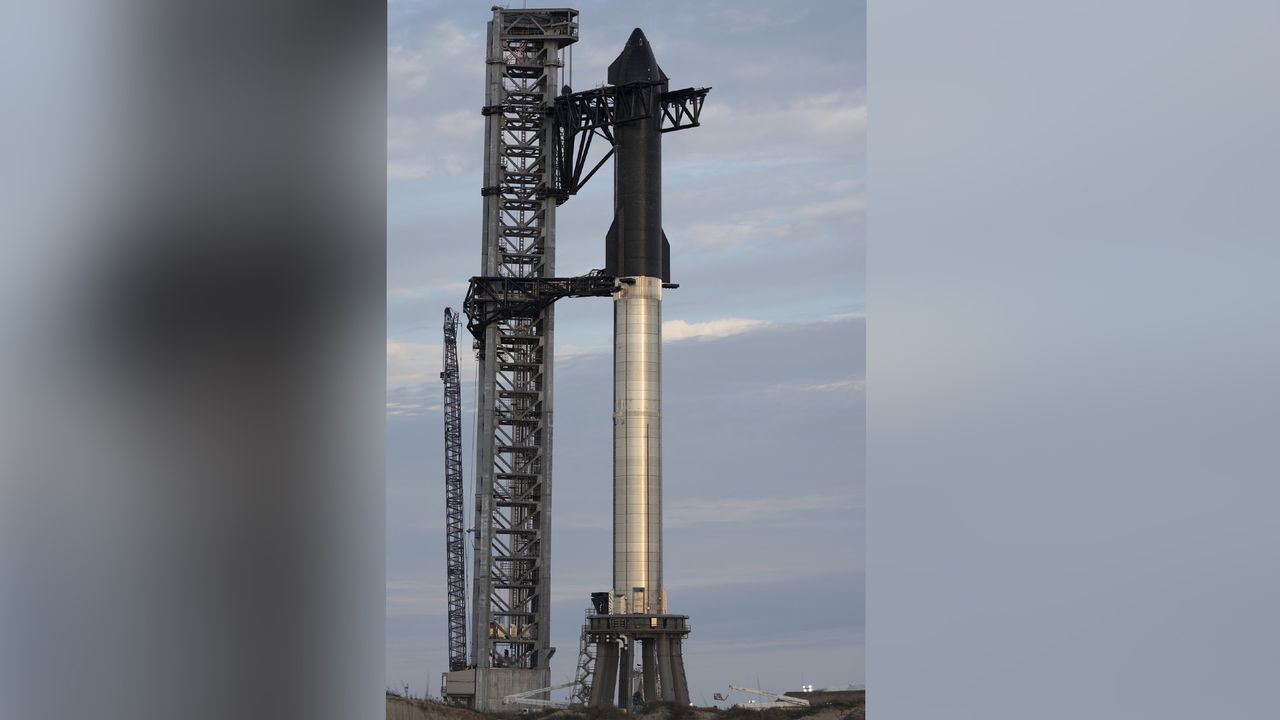 SpaceX CEO Elon Musk unveiled this view of the company's Starship SN20 prototype attached to its Super Heavy booster near Boca Chica village in South Texas on Feb. 10, 2022 ahead of a project update.