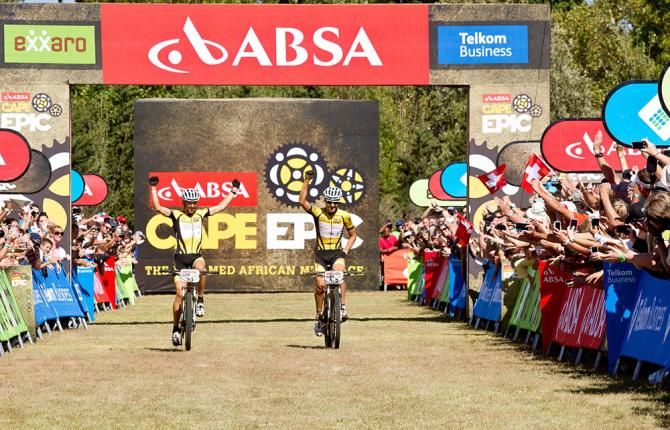 Christoph Sauser (L) and Jaroslav Kulhavy (R) cross the line as overall winners