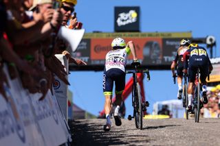 Louis Meintjes runs to the finish of stage 7 of the 2022 Tour de France