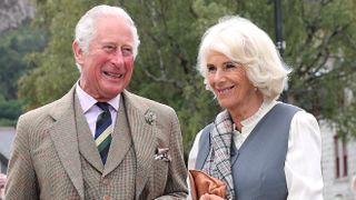 Prince Charles, Prince of Wales and Camilla, Duchess of Cornwall smile as they visit local shops and businesses