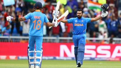 India batsman Rohit Sharma celebrates his century against Pakistan with captain Virat Kohli 