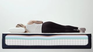 A side sleeper rests on the Aurora Luxe Mattress