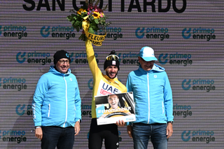 Adam Yates on the podium in the race lead after stage 4 of the 2024 Tour de Suisse