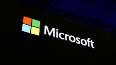 Microsoft logo and branding illuminated against a dark background at Mobile World Congress (MWC) in Barcelona, Spain.