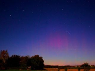 Jesper Grønne of Silkeborg, Denmark caught a striking image of Draconid meteors and an aurora in October, 2011.