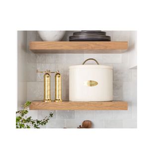 white brass metal bread box on kitchen open shelf