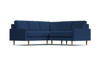A navy blue velvet L-shaped sofa