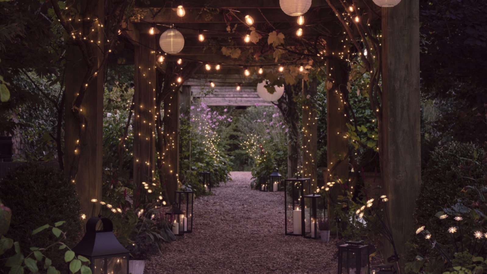 Solar lanterns, string lights and globes in gazebo