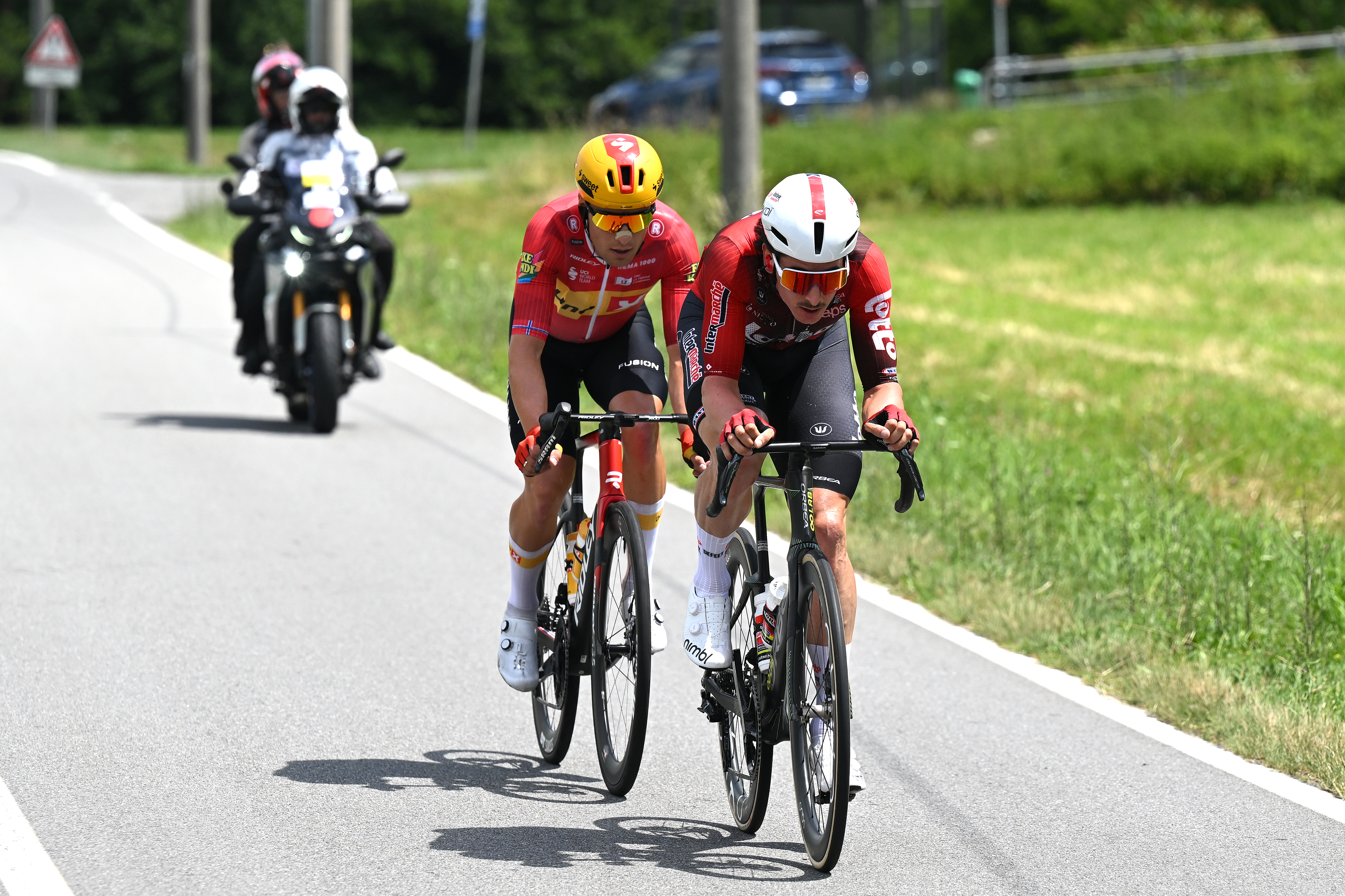 SONDRIO, ITALY - JUNE 17: (L-R) Fredrik Dversnes Lavik of Norway and Team Uno-X Mobility and  Cedric Beullens of Belgium and Team Lotto Intermarche compete in the breakaway during the 89th Tour de Suisse 2026, Stage 1 a 144km stage from Sondrio to Sondrio / #UCIWT / on June 17, 2026 in Sondrio, Italy. (Photo by Tim de Waele/Getty Images)