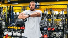 Man doing kettlebell workout in gym