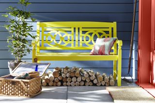 garden bench painted bright yellow