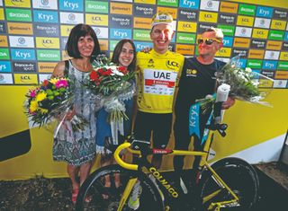 Tadej celebrates his 2021 Tour win with Marjeta, sister Vita and Mirko