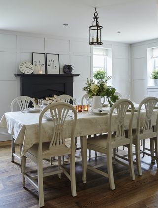 farmhouse dining room with black fireplace