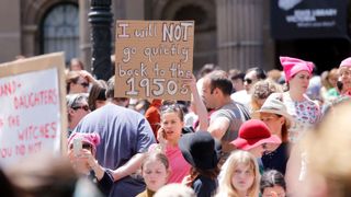 Ear, Hat, Mammal, Pink, Crowd, Fashion accessory, Headgear, Public event, Sun hat, Protest,