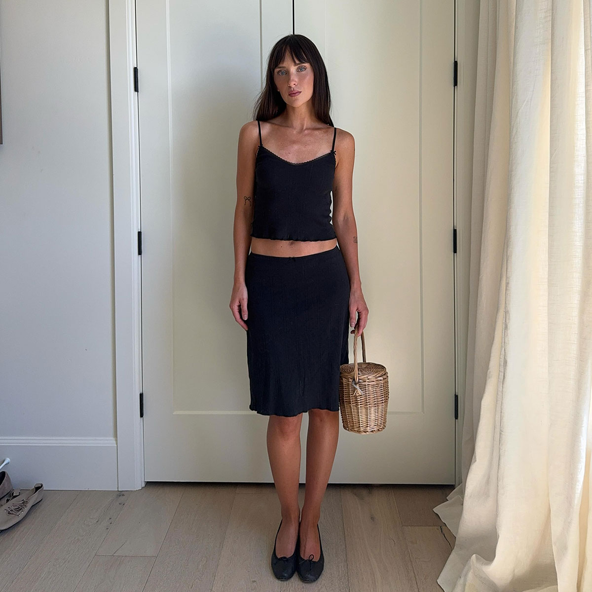 @makenna_alyse summer outfit photo in black simple tank and black slip skirt to the knee