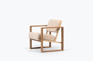 Back view of wooden lounge chair with upholstered seat and back by Erich Dieckmann