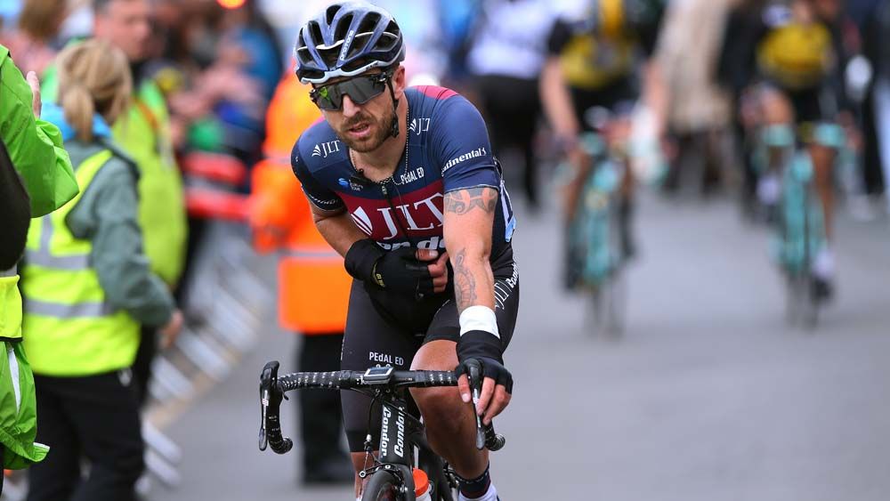 Russ Downing crossed the line on his bike but in a lot of pain