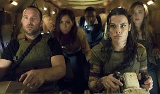 Blindspot Jaimie Alexander and her team in an armored vehicle