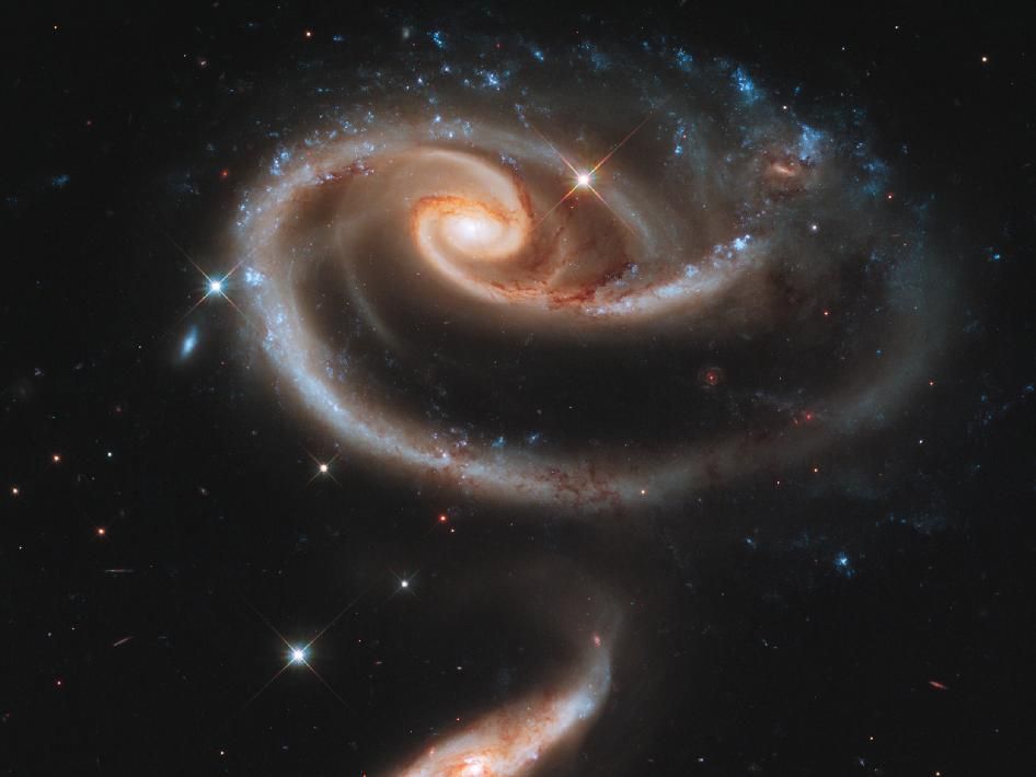 To celebrate the 21st anniversary of the Hubble Space Telescope, astronomers pointed Hubble&#039;s eye at an especially photogenic pair of interacting galaxies called Arp 273.