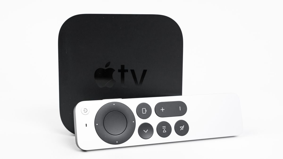 ew unpacked Apple TV 4K console and Siri Remote control with a touch-enabled clickpad laying nearby on a white background