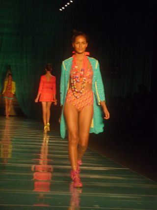 Models in pink swimwear with turquoise or neon yellow kaftans