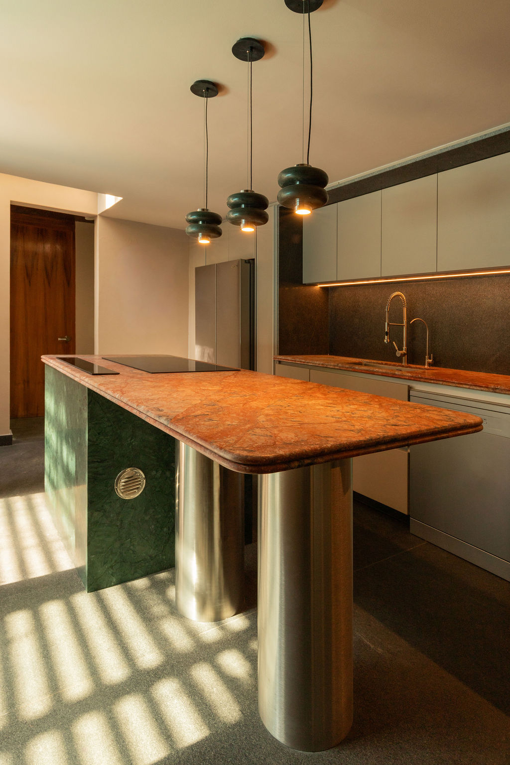Newly designed spaces, such at the kitchen and bathrooms, share bold and sculptural aesthetics.
