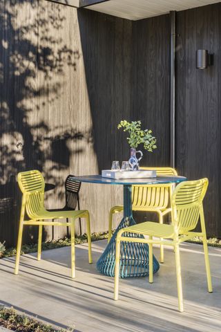 An outdoor area with colorful chairs