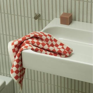 red and white check towel by baina